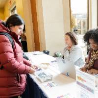 Individual helping with check in